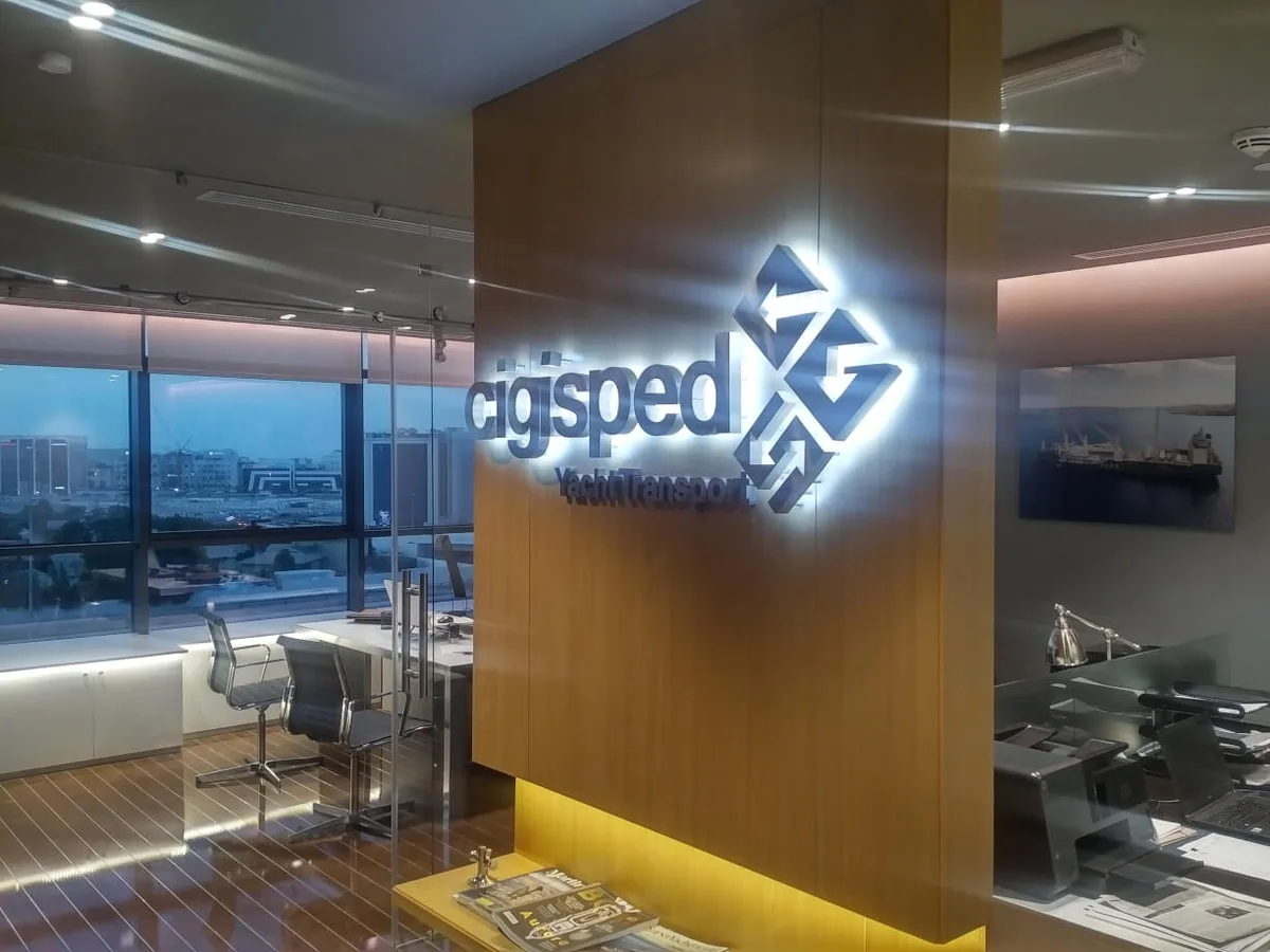 Reception of the Cigisped office in Dubai with the illuminated Cigisped logo