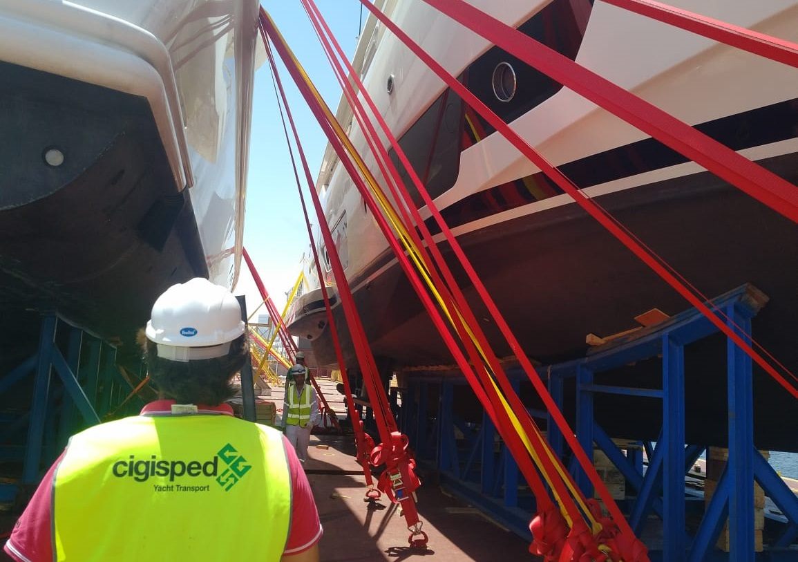 Cigisped loadmaster checking lashing straps on a superyacht during loading for Saudi Arabia