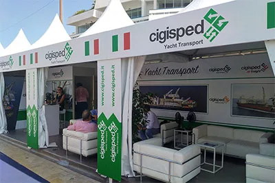 Cigisped Yacht Transport stand with white sofas at the Cannes Yacht Show